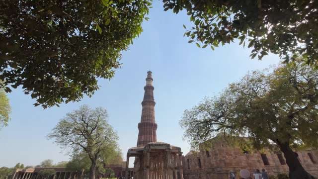 Qutub Minar Tower Rising Above Historic Ruins in Delhi