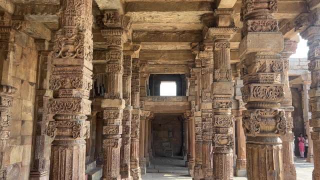 Intricately Carved Stone Pillars in Ancient Indian Temple