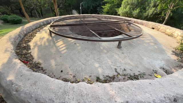 Covered Stepwell Structure in Lush Urban Park Setting