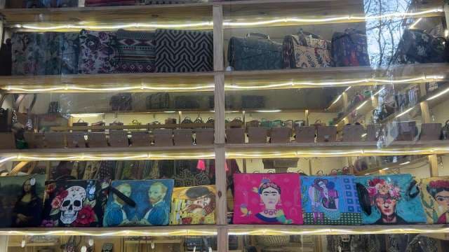 Colorful Designer Handbags Featuring Iconic Artworks on Display