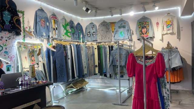 Trendy Hand-Painted Denim and Dresses in Boutique Store