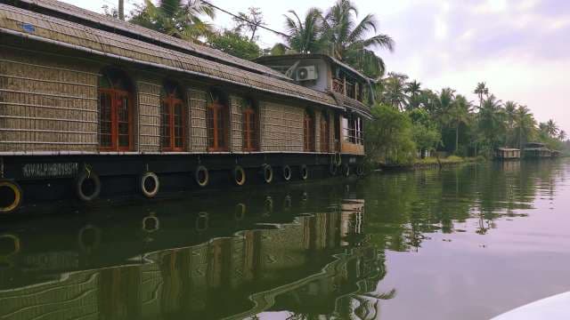 Traditional Kerala Houseboat Cruising Backwaters in Alleppey