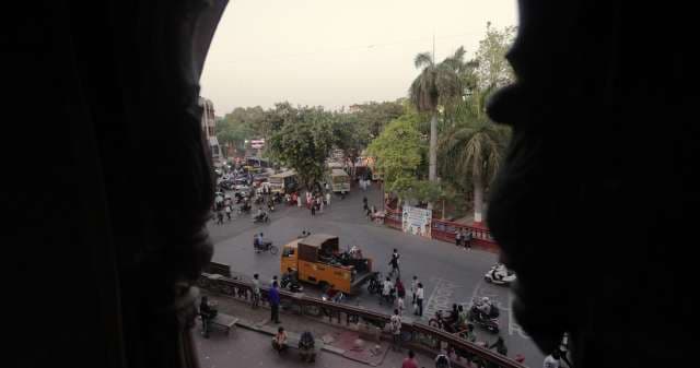 Busy Indian Intersection Viewed from Historic Archway