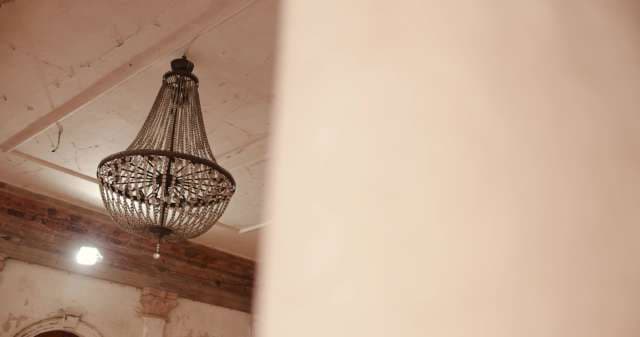 Elegant Antique Chandelier in Rustic Interior Setting