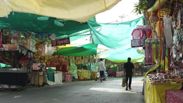 Bustling Street Market in India With Colorful Stalls
