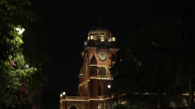 Illuminated Clock Tower at Night in Indore