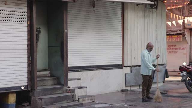 Early Morning Street Cleaning in Indian City Market