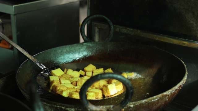 Crispy Tofu Cubes Deep Frying in Wok