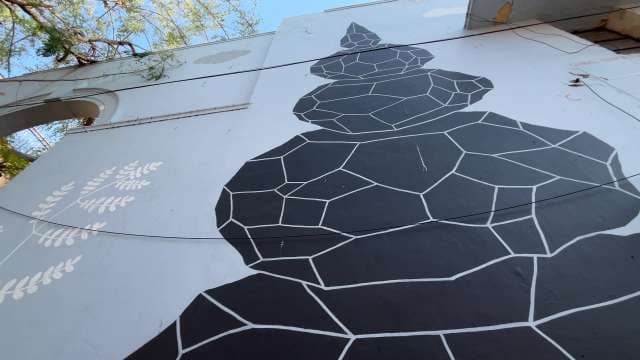 Geometric Black and White Mural on Urban Wall