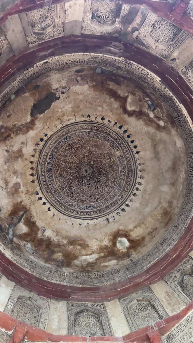 Intricate Islamic Dome Ceiling With Ornate Calligraphy Patterns