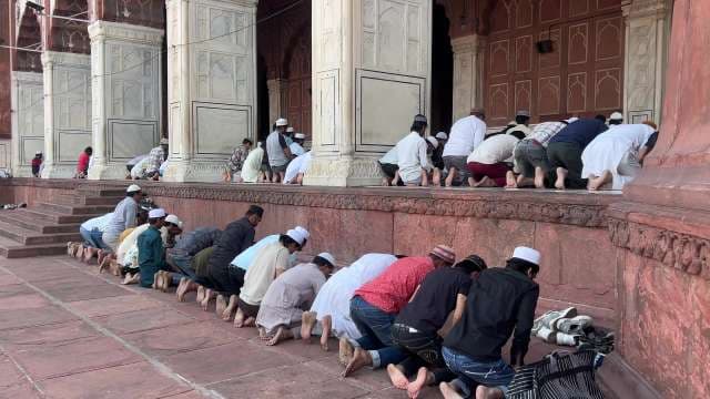 Group Prayer at Historic Mosque in Delhi