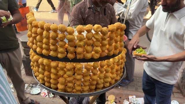 Indian Street Vendor Serves Fresh Pani Puri to Crowd