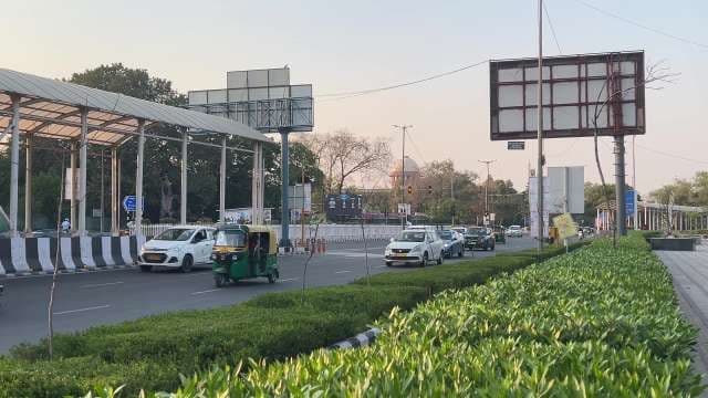 City Traffic and Auto Rickshaw on Busy New Delhi Street