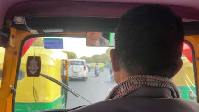 Auto Rickshaw Ride Through Bustling Delhi Streets