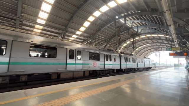 Delhi Metro Train Arrives at Elevated Station Platform