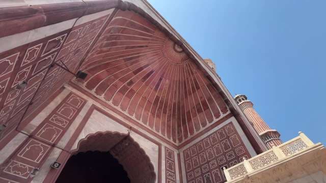 Majestic Mughal Archway and Minaret Against Blue Sky