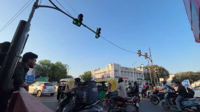 Busy Traffic Scene at Connaught Place Intersection, Delhi
