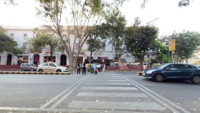 Busy Urban Street Intersection With Pedestrian Crossing in Delhi