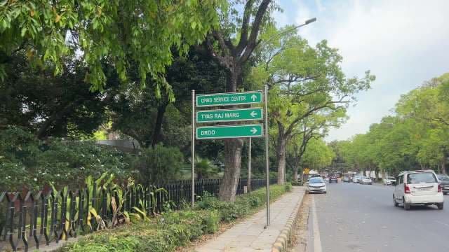 Street Signs and City Traffic on Tyag Raj Marg, Delhi