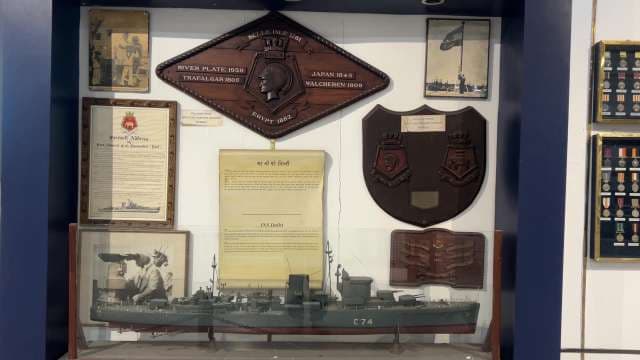 INS Delhi Naval Legacy: Model, Medals, and Memorabilia Display