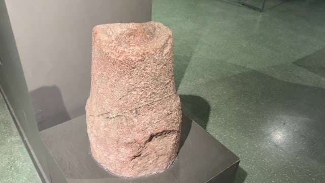 Ancient Stone Mortar Displayed in Museum Exhibit