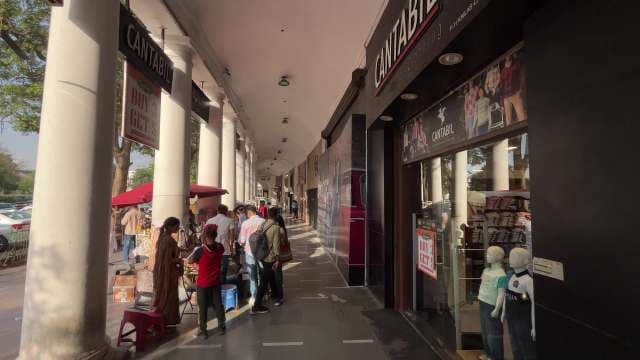 Bustling Shopping Walkway at Connaught Place, Delhi
