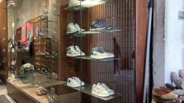 Modern Sneaker Display in Stylish Retail Shoe Store Window