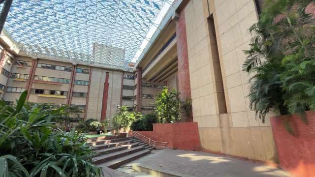 Modern Atrium with Glass Ceiling and Indoor Greenery