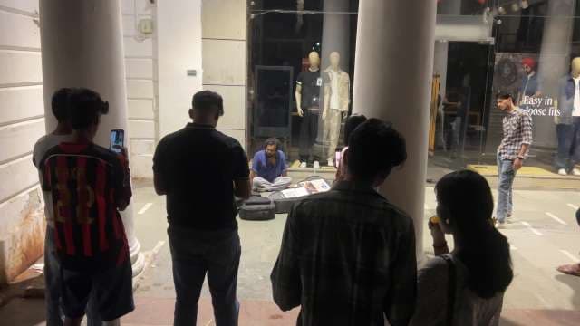 Street Artist Performing for Crowd at Connaught Place Delhi