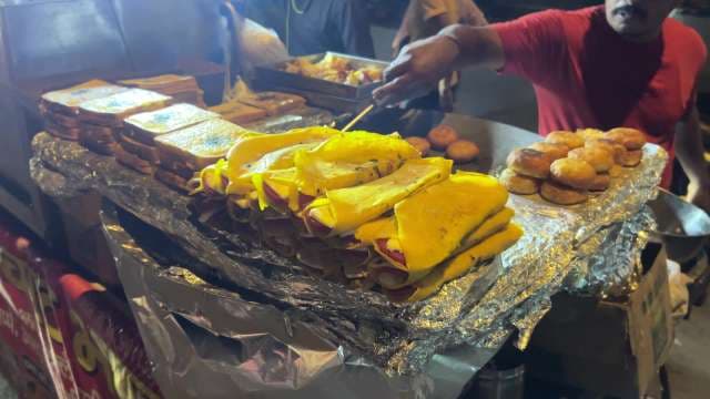 Indian Street Food Vendor Serves Omelette Sandwiches and Fried Snacks