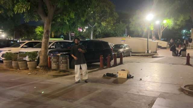 Street Performer Entertains at Connaught Place Night Scene
