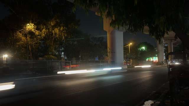 Night City Traffic Lights Under Elevated Roadway