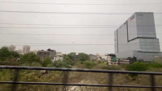 Modern Office Tower Overlooking Urban Greenery in Gurugram