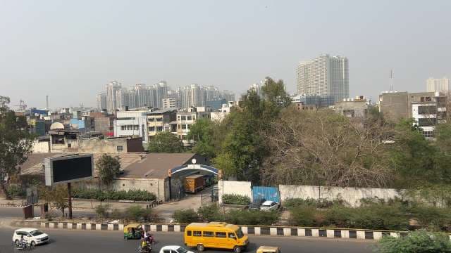 Modern Urban Skyline Overlooks Bustling City Street