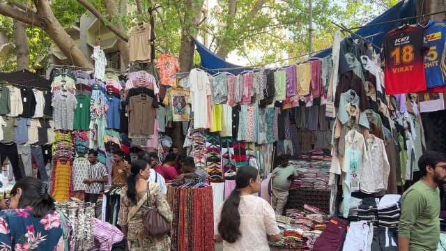Vibrant Street Market With Colorful Clothing Stalls in Mumbai