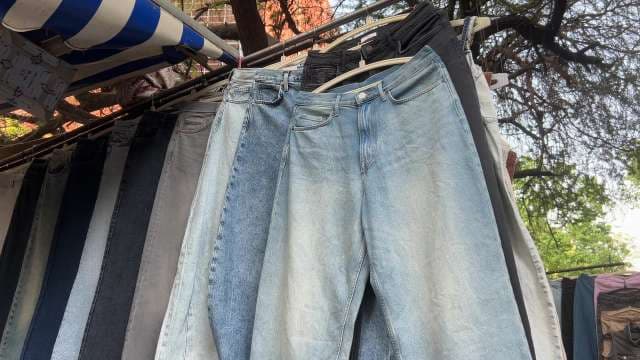 Colorful Denim Jeans on Display at Outdoor Market