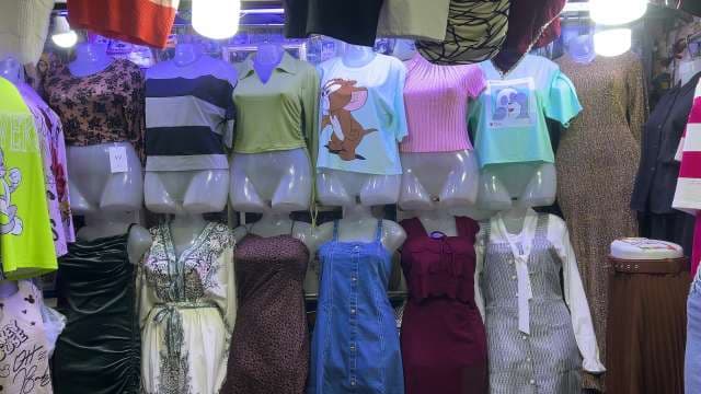 Trendy Women's Outfits Displayed on Mannequins in Clothing Store