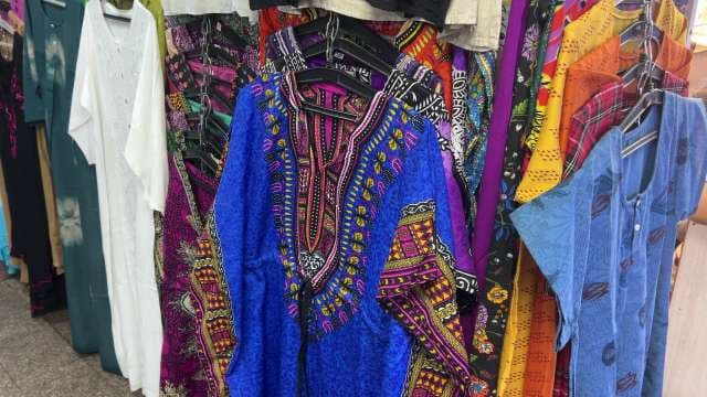 Vibrant Ethnic Dresses on Display in Market Stall