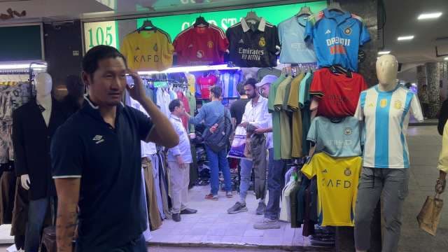 Popular Football Jerseys Displayed at Market Stall