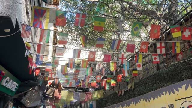 Colorful International Flags Decorating Outdoor Alleyway