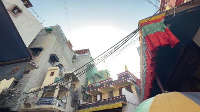 Bustling Street Scene Near Buddhist Monastery in India