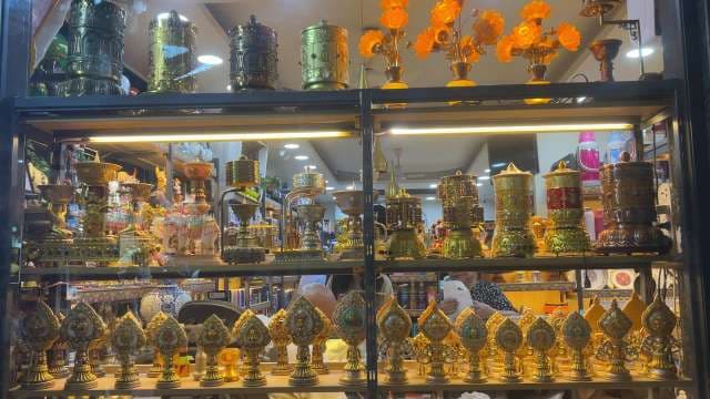 Tibetan Prayer Wheels and Ritual Items in Shop Display