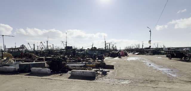 Busy Fishing Harbor With Boats And Daily Activity