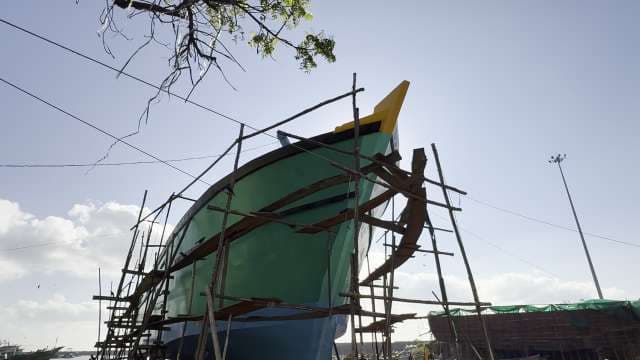 Traditional Wooden Boat Construction at Coastal Shipyard