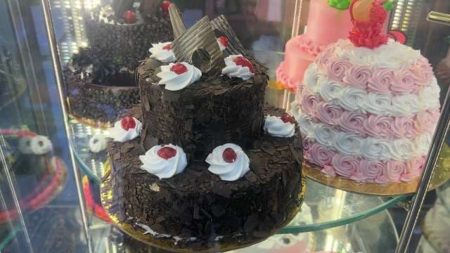 Delicious Black Forest Chocolate Cake Displayed in Bakery