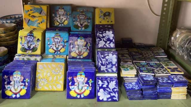 Hand-Painted Ceramic Tiles Featuring Floral and Ganesha Art