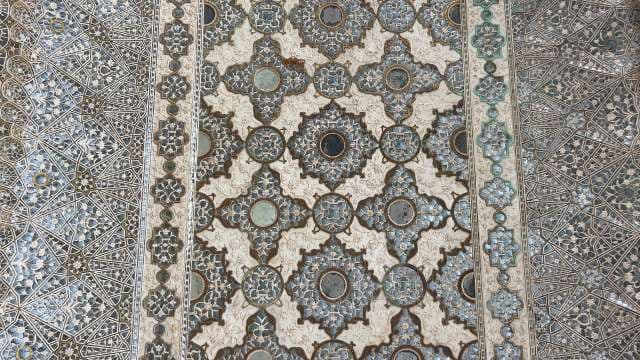 Intricate Islamic Geometric Patterns on Palace Wall