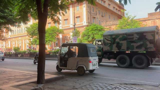 Busy Jaipur Street with Auto Rickshaw and Military Truck