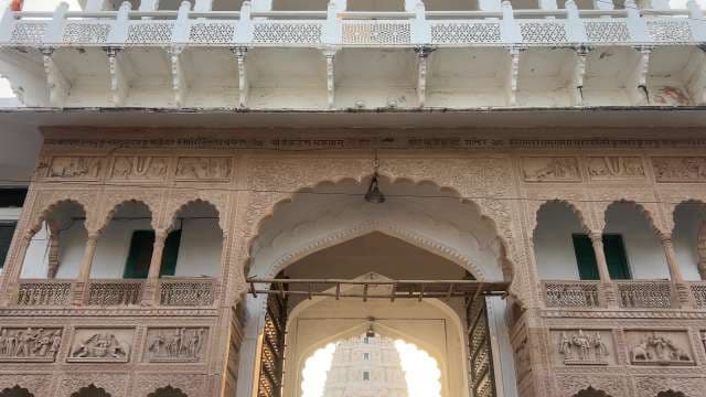 Intricate Indian Temple Entrance With Ornate Arches and Carvings