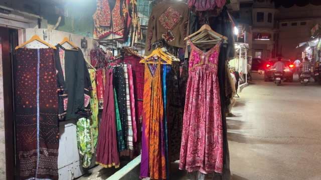 Colorful Traditional Indian Dresses Displayed at Night Market
